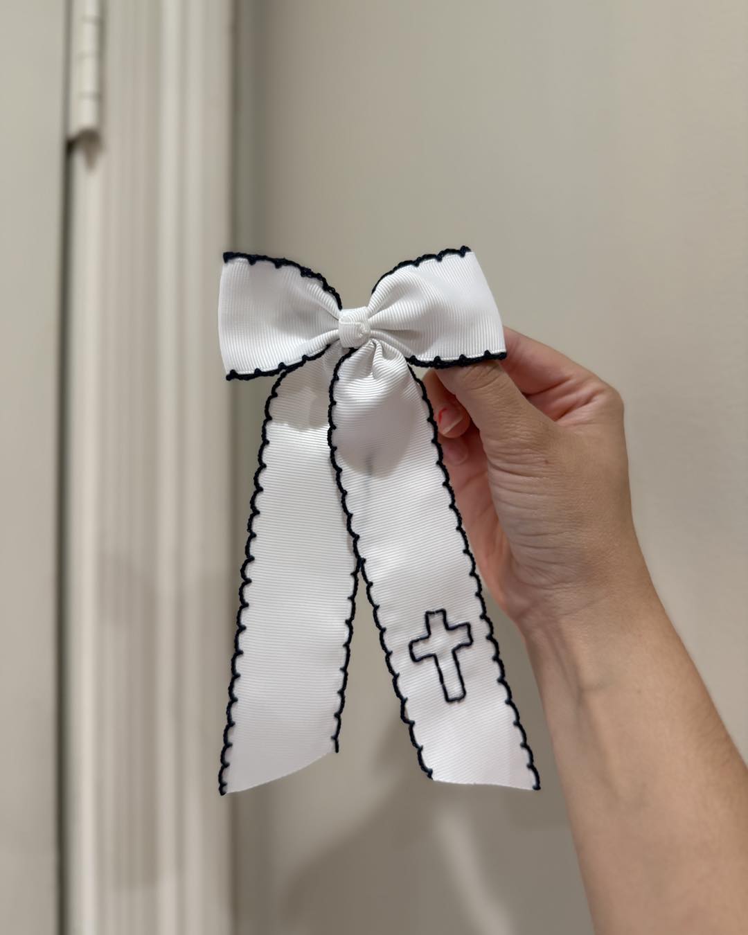 White Cross Bow with Navy Stitching